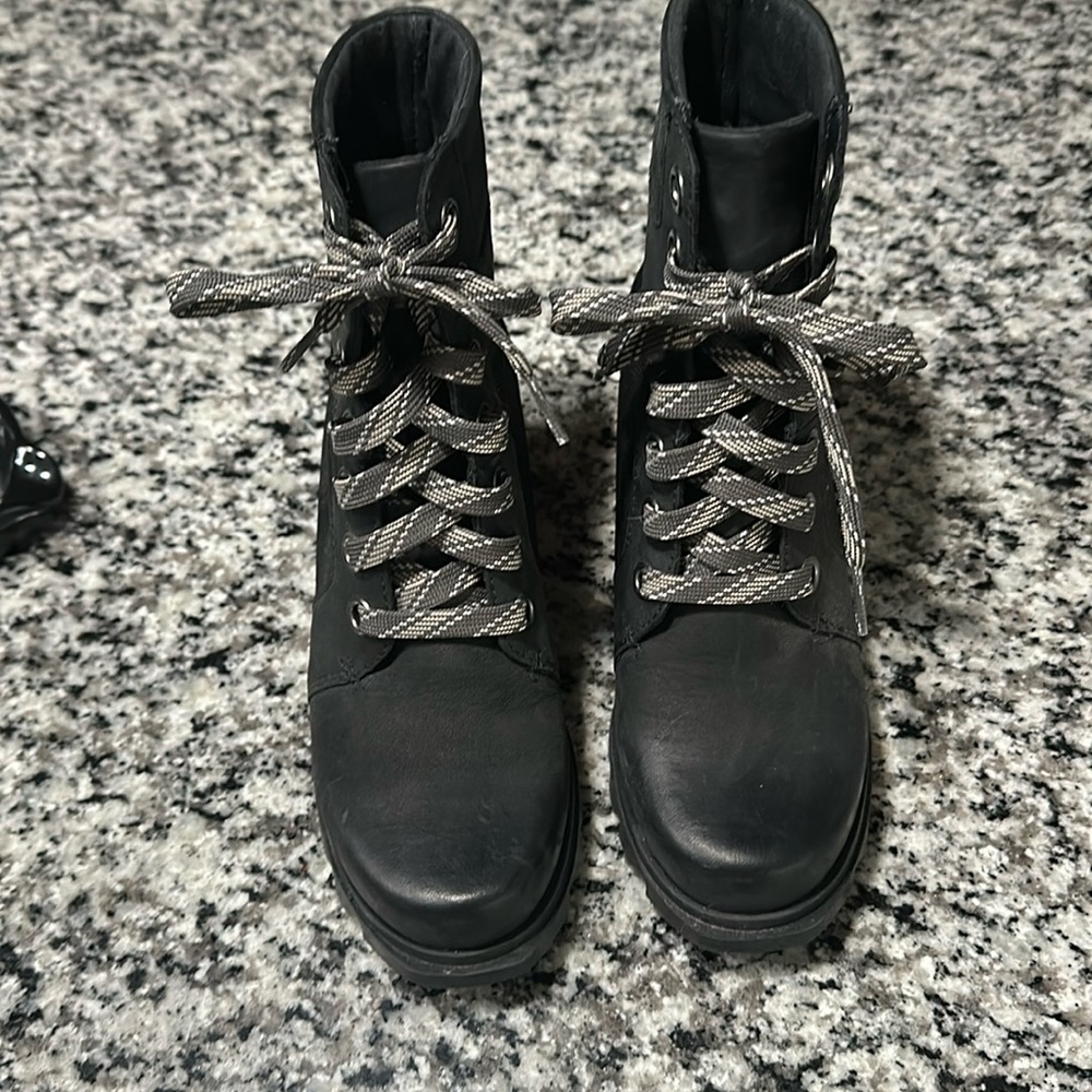 Black Sorel boots.